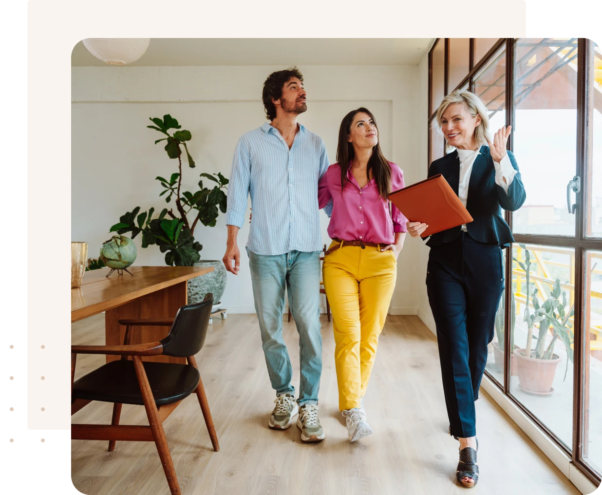 Couple touring modern apartment with agent